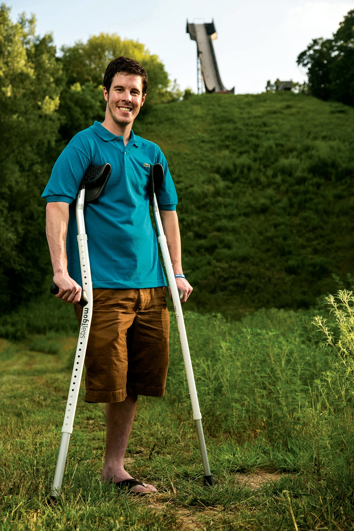 A long-term Mobilegs user standing outdoors with his Ultra crutches