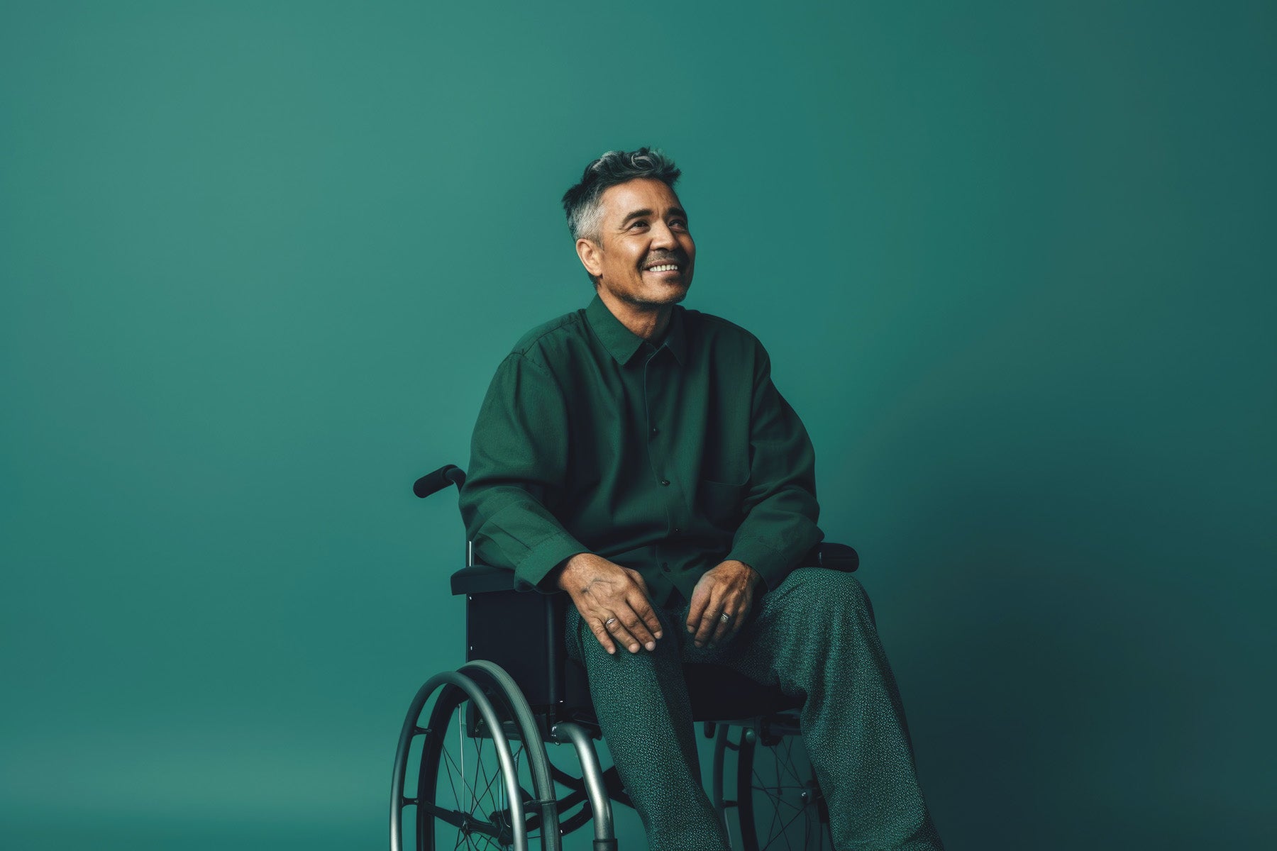 Man wearing green in a wheelchair.